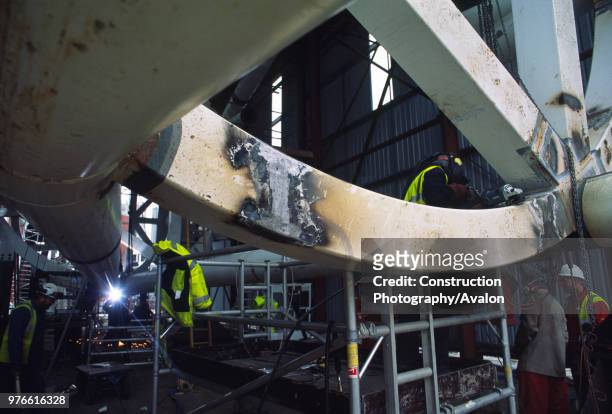 Wembley stadium-London: Welding sheds for sections of the interlacing steel tubes of the signature arch, constructed on the ground by Cleveland...