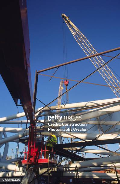 Wembley stadium-London: Inspecting welds on the interlacing steel tubes of the signature arch, constructed on the ground by Cleveland Bridge After...