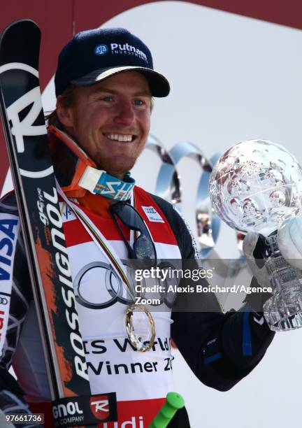 Ted Ligety of the USA takes the globe for the overall World Cup Giant slalom during the Audi FIS Alpine Ski World Cup Men's Giant Slalom on March 12,...