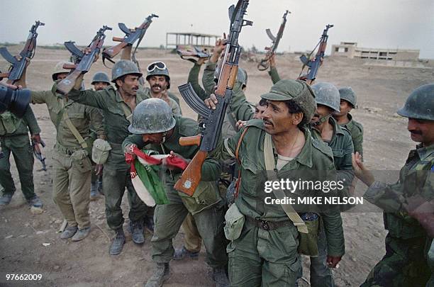 Iraqi soldiers celebrate their victory over Iran 20 April 1988 in the strategic Faw peninsula of southeast Iraq that was partly occupied by Iranian...