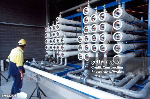 Installing the horizontal pressure vessels tubes for the reverse osmosis stage in the process, Queensland, Australia.
