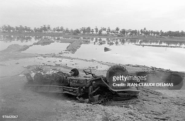 Destroyed army truck lay in the swamp near the Iraqi city of al-Howeizah, north of Basra, 22 March 1985 after a fierce battle opposed Iraqi and...