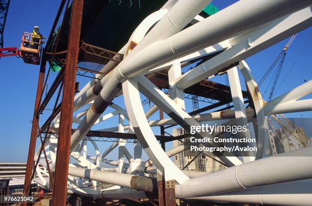 Wembley stadium-London: Inspecting welds on the interlacing steel tubes of the signature arch, constructed on the ground by Cleveland Bridge After...