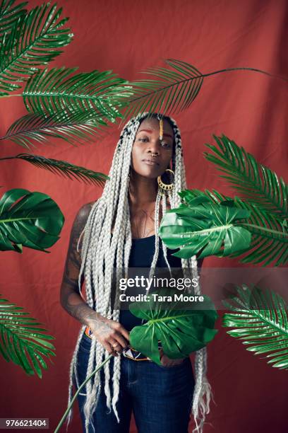 urn=ban woman surrounded by leaves