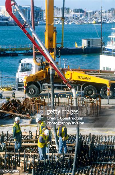 Concrete pour for the base foundation slabs on the Spinnaker Tower project in Portsmouth Harbour in background.