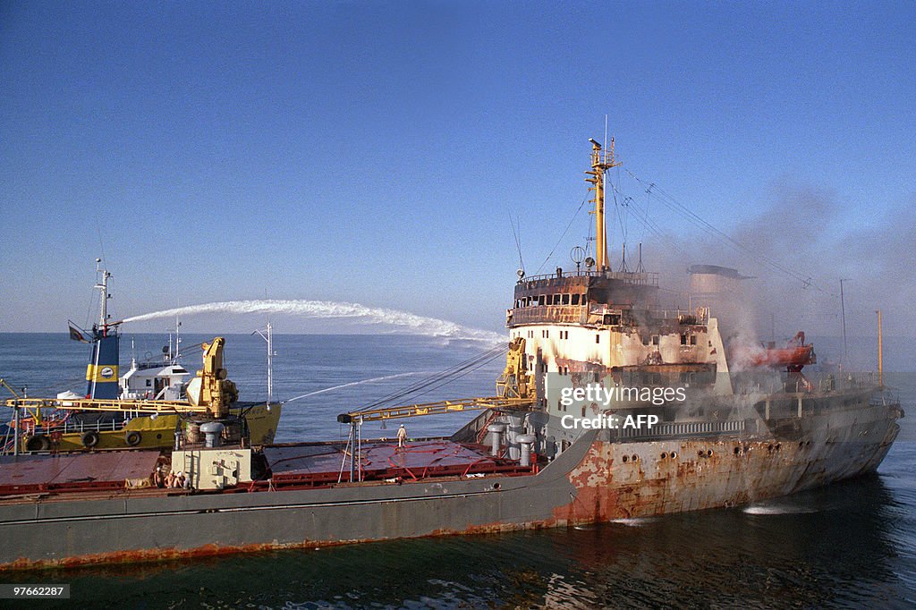 A tugboat puts out a fire November 23, 1