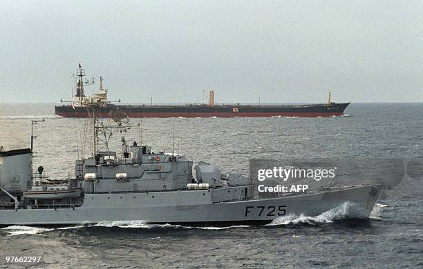 Photo taken 18 January 1988 of the French warship F725 pictured alongside the Japanese flagged tanker Ikuyo Maru as she enters the Strait of Hormuz...