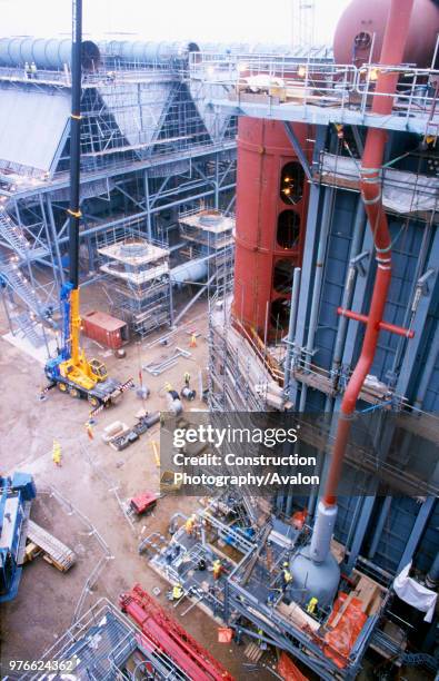 View past huge heat exchanger unit to new style peak roof coolers on the Spalding gas-fed power station in East Anglia.