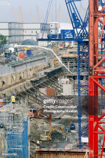 Pumping concrete into foundations of large scale construction site, Canary Wharf, London.