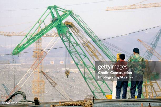 Surveyors during the construction of the Three Gorges Dam, Yichang, Yangtse river, China.