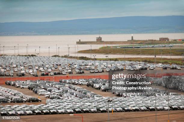 New Suzuki cars and vans parked at Avonmouth docks near Bristol, UK.