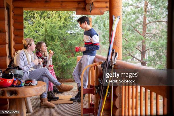 taking a break from skiing - friends skiing stock pictures, royalty-free photos & images