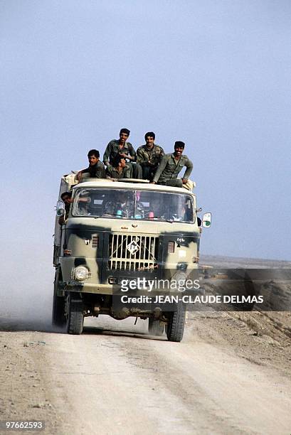 Iraqi troops drive to the front line on March 20, 1985 after the battle for the city of al-Howeizah, north of Basra. The Iraq-Iran war began in...