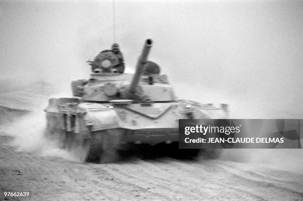 An Iraqi tank drives to the Al-Howeizah swamps, north of Basra on March 18, 1985. The Iraq-Iran war began in September 1980 after Iraqi troops and...