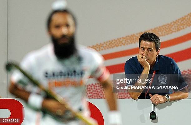 Indian hockey coach Jose Brasa looks on during the World Cup 2010 Classification match against Argentina at the Major Dhyan Chand Stadium in New...