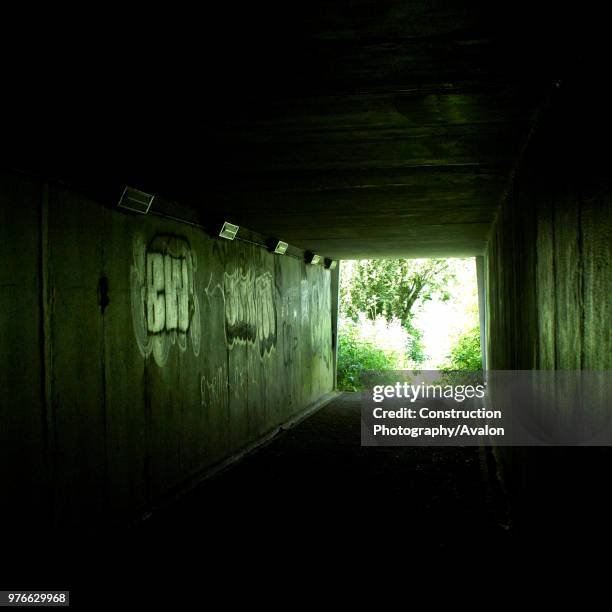 Unlit pedestrian tunnel underneath the M1 motorway, Hertforshire, UK.