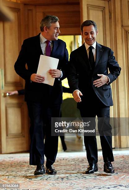 British Prime Minister Gordon Brown and French President Nicolas Sarkozy arrive for a press conference inside 10 Downing Street on March 12, 2010 in...