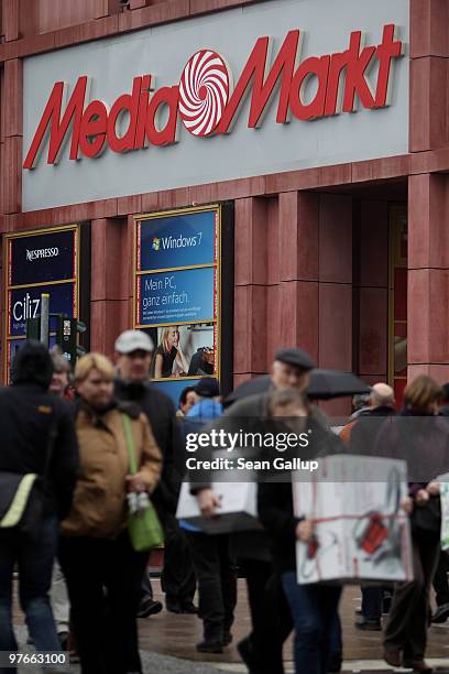 Shoppers leave a shopping mall that contains a store of German consumer electronics retail chain Media Markt on March 12, 2010 in Berlin, Germany....