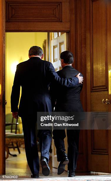 British Prime Minister Gordon Brown and French President Nicolas Sarkozy leave after a press conference inside 10 Downing Street on March 12, 2010 in...