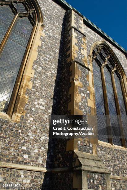 Stained glass window on the perpendicular gothic style medieval Church of St Andrew, Norwich, UK.