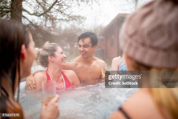champagne in the hot tub - hot tub party stock pictures, royalty-free photos & images