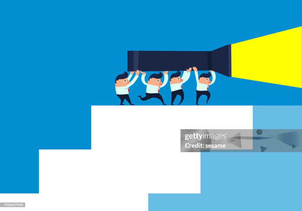 Team holding flashlight climbing stairs