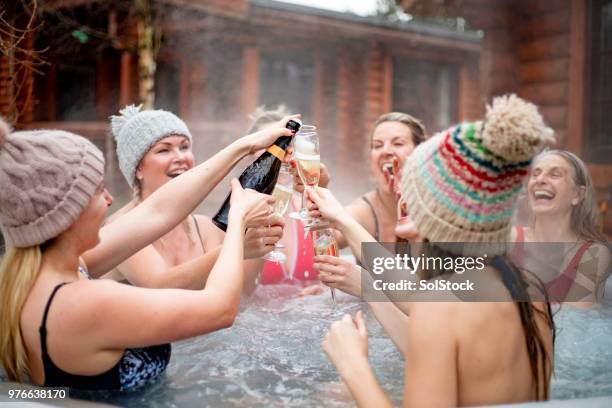 champagne in the hot tub - hot tub party stock pictures, royalty-free photos & images