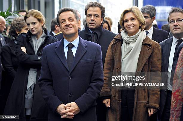 France's President Nicolas Sarkozy accompanied by Junior Minister for Forward Planning and Development of the Digital Economy Nathalie...
