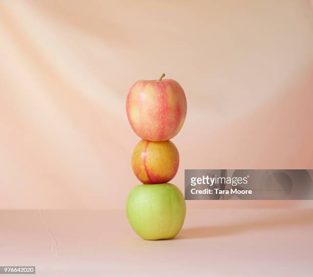 three apples in a pile