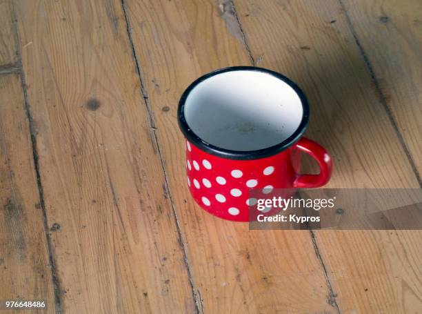 europe, greece, 2018: view of red polka dot enamel mug - enamel mug stock pictures, royalty-free photos & images