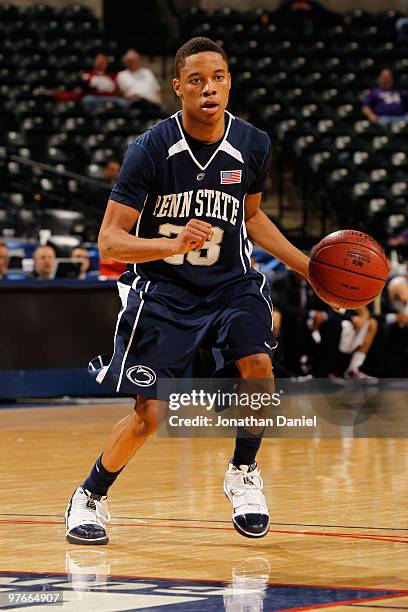 Guard Tim Frazier of the Penn State Nittany Lion controls the ball against the Minnesota Golden Gophers during the first round of the Big Ten Men's...