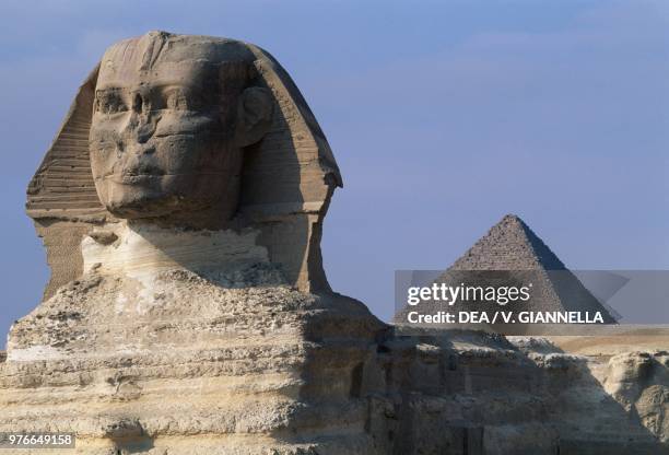 The Sphinx and the pyramid of Mycerinus , Cairo, Egypt.