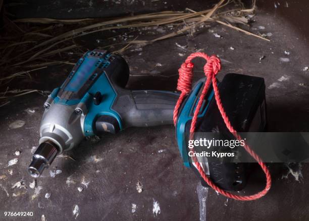 europe, greece, 2018: view of cordless impact wrench (powered by rechargeable 18v li-ion battery) - torque wrench stock pictures, royalty-free photos & images
