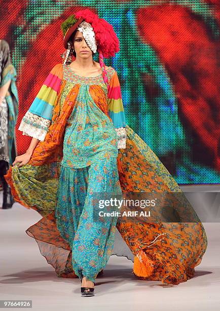 Model presents a creation by Pakistani designer Nickie Nina on the first day of Pakistan Fashion Design Council Sunsilk Fashion Week in Lahore on...