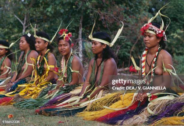 Women wearing traditional dance costumes, called fear dance, Bechial village, Yap state, Micronesia.
