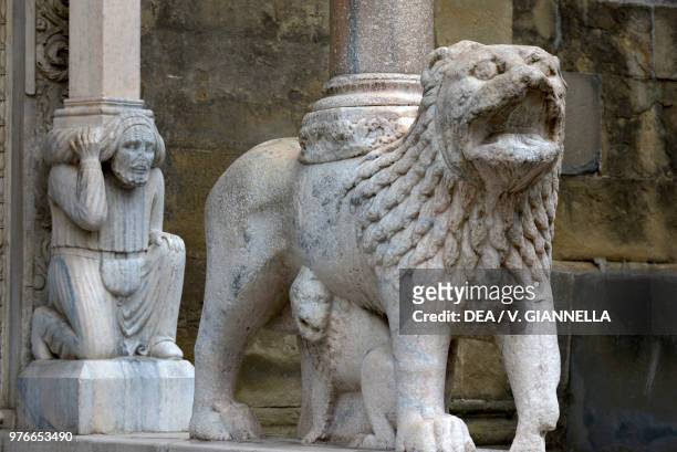 Column-bearing lion, door of the white lions or southern gate, Basilica of Santa Maria Maggiore, Bergamo, Lombardy, Italy, 14th century.