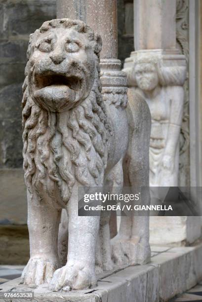Column-bearing lion, door of the white lions or southern door, Basilica of Santa Maria Maggiore, Bergamo, Lombardy, Italy, 14th century.