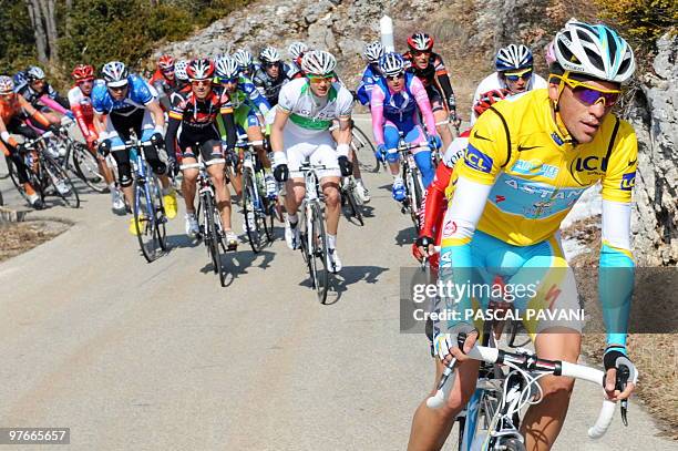 Yellow jersey of overall leader, Kazahkstan's Astana cycling team's Spain's Alberto Contador rides in the pack ahead of Spanish cycling team Caisse...