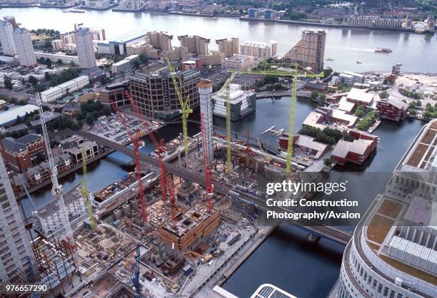 Overview of construction site alongside suburban railway station, Canary Wharf, London, United Kingdom,.