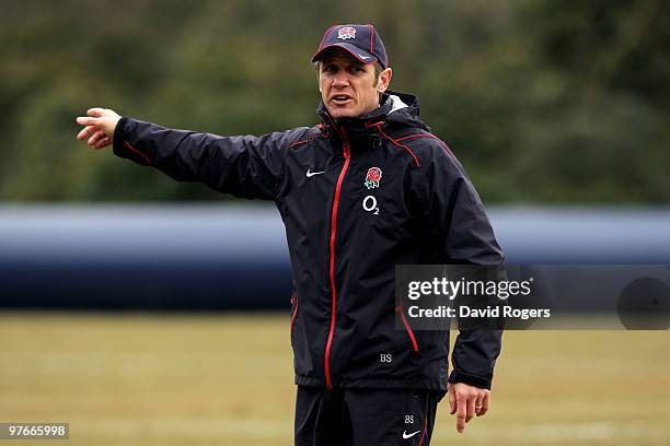 Brian Smith the England backs coach instructs players during the England rugby union squad training session at Pennyhill Park on March 12, 2010 in...