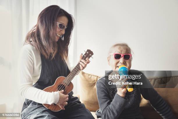 homemade rock band wearing toy sunglasses - daughter band stock pictures, royalty-free photos & images