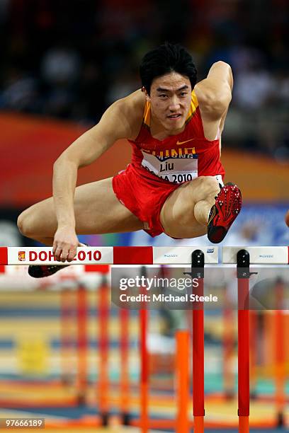 Xiang Liu of China competes in the mens 60m hurdle heats during Day 1 of the IAAF World Indoor Championships at the Aspire Dome on March 12, 2010 in...