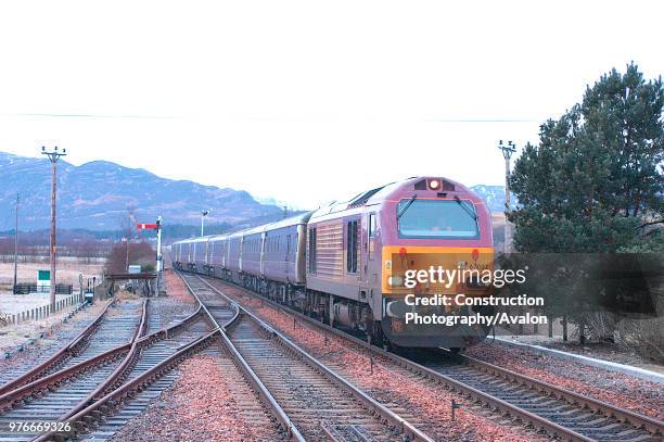 This early morning scene at Kingussie catches the arrival of the Euston - Inverness sleeper service, a rarely photographed train that starts from...