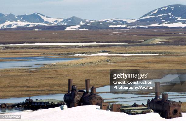 Three former New York Elevated, Baldwin and New York Locomotive Company, 0-4-4 Forney locomotives. Lie abandoned on the Arctic Tundra in the mouth of...