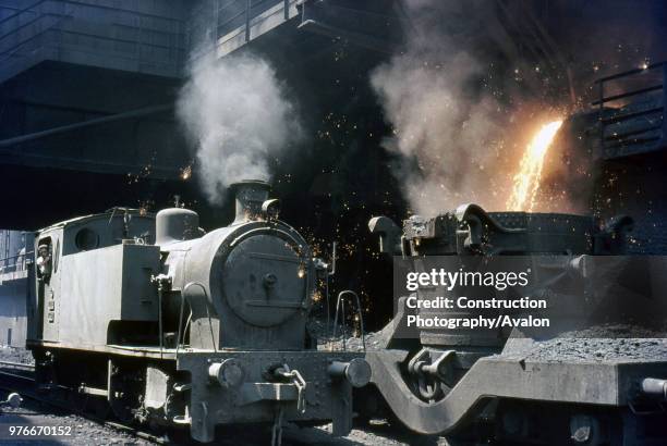 Turkey's Karabuk Steel Works with Hawthorn Leslie 0-6-0ST No.3302 tipping molten waste down the slag bank, Wednesday 11 August 1976.