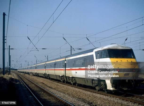 InterCity 225 in British Rail InterCity livery heads south along the East Coast Main Line powered by a class 91 locomotive at the rear.