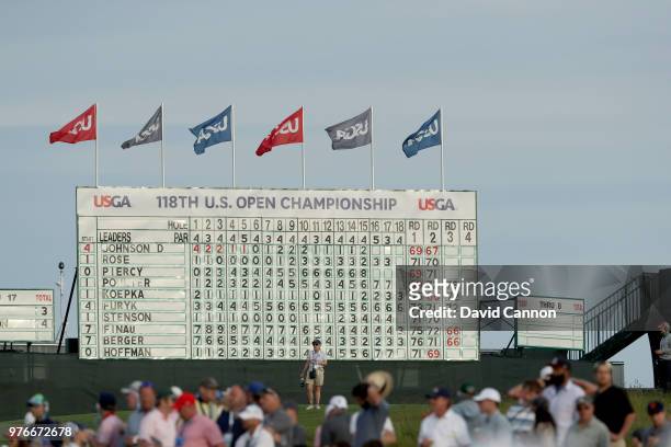 The main scoreboard on the 18th hole shows not a single player under par near the end of play during the third round of the 2018 US Open at...
