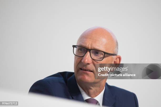 April 2018, Germany, Duesseldorf: Timotheus Hoettges, CEO of the German Telekom and boardmember at Henkel, attends a general meeting of the company....