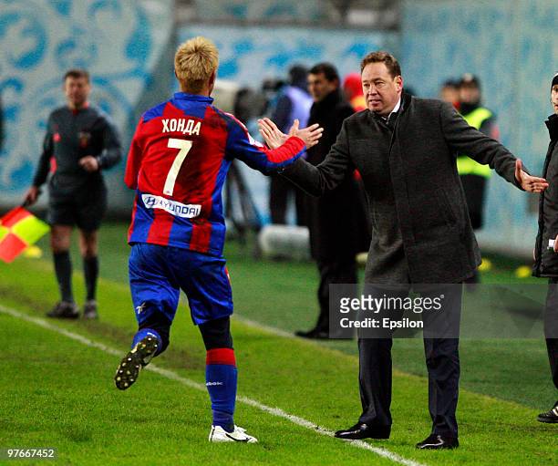 Head coach Leonid Slutsky and Keisuke Honda of PFC CSKA Moscow celebrate after scoring a goal during the Russian Football League Championship match...