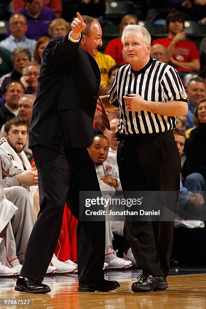 Head coach Thad Matta of the Ohio State Buckeyes speaks with an official after a play during the game against the Michigan Wolverines in the...